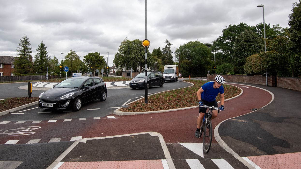 Cars and cyclists on a roundabout