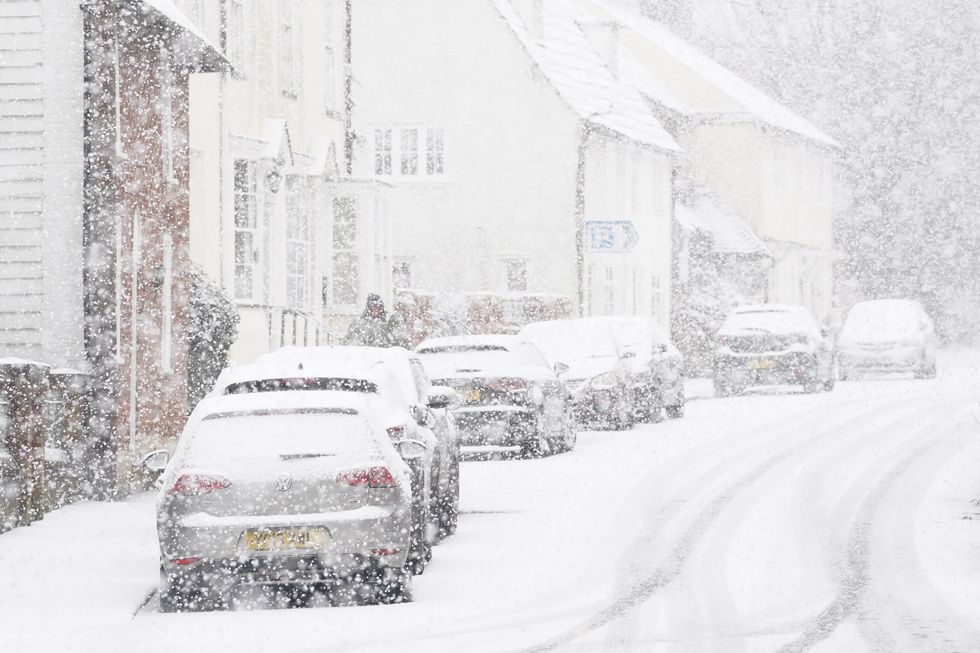 Cars covered in snow