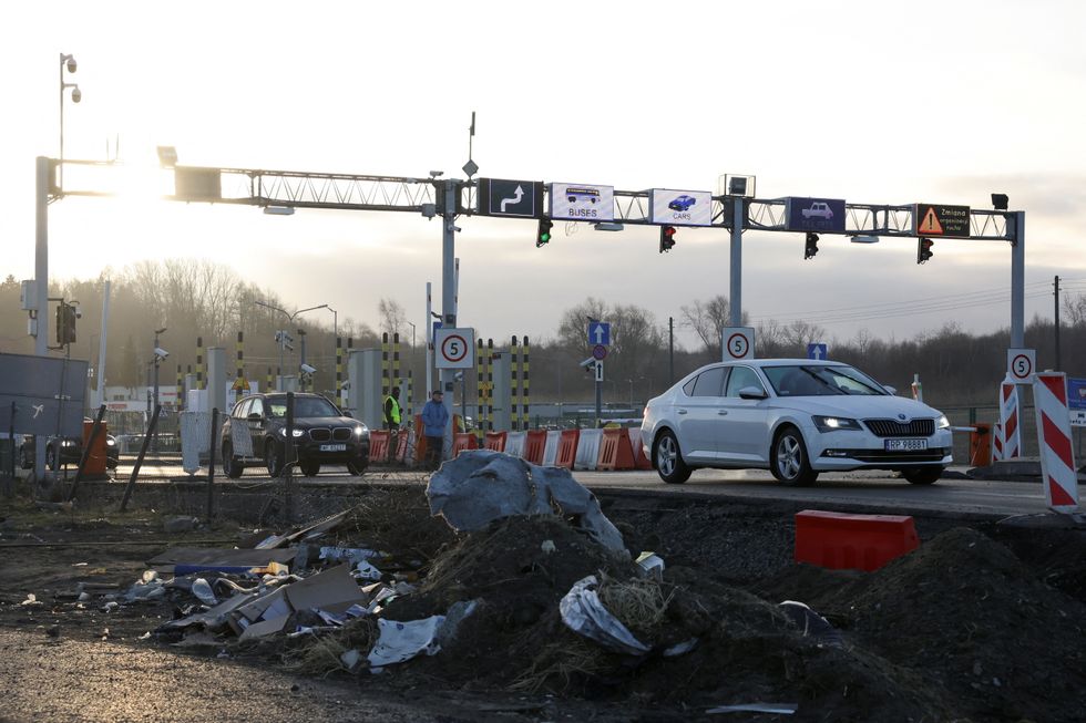 Cars drive at the border crossing between Poland and Ukraine, after Russian President Vladimir Putin authorised a military operation in eastern Ukraine, in Medyka, Poland, February 24, 2022. REUTERS/Kacper Pempel