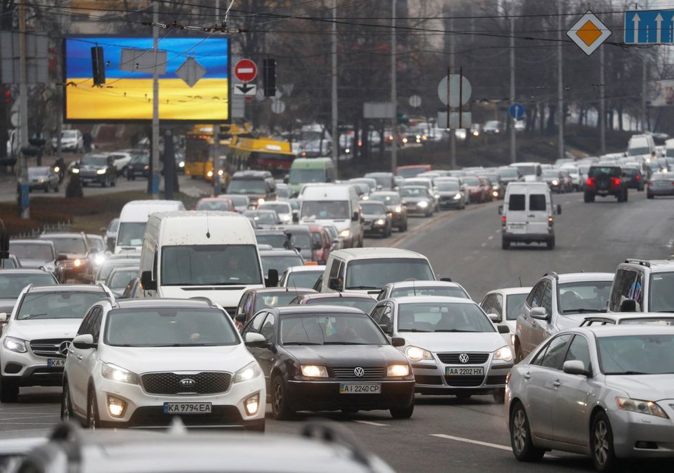 Cars drive towards the exit of the city after Russian President Vladimir Putin authorised a military operation in eastern Ukraine, in Kyiv, Ukraine February 24, 2022. REUTERS/Valentyn Ogirenko