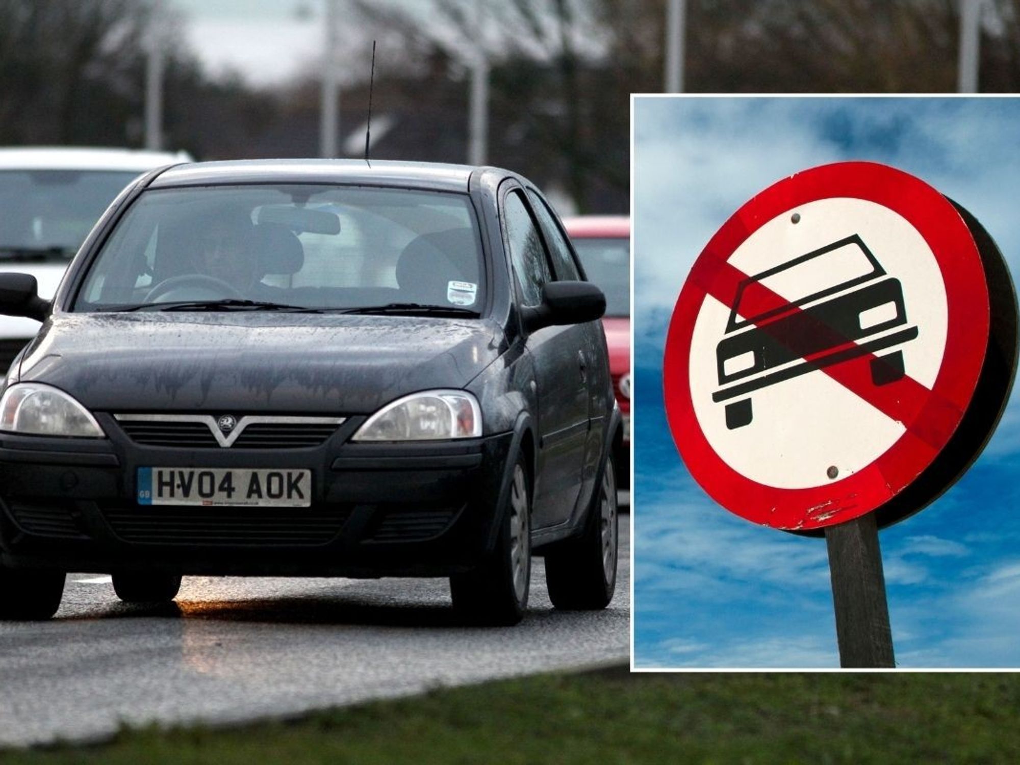 Cars driving and a vehicle ban sign