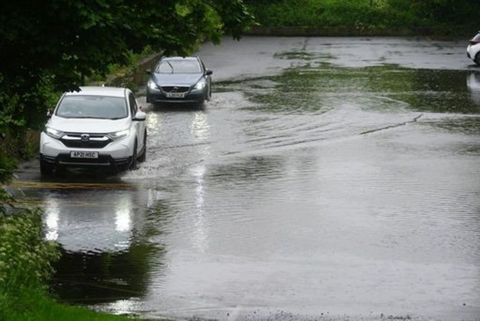 Cars driving in flooding