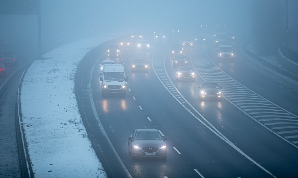 Cars driving in mist
