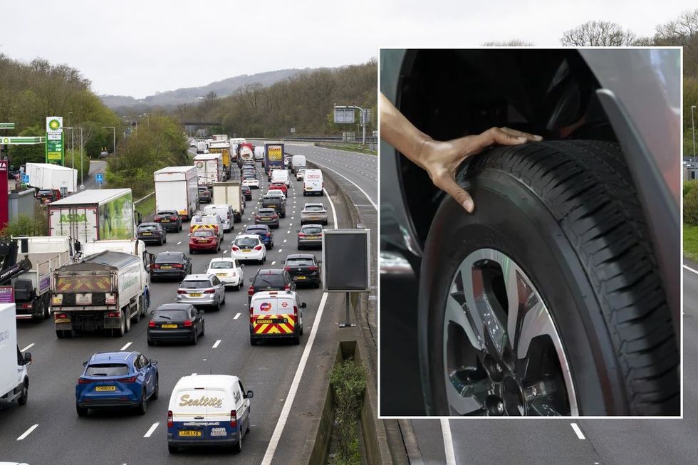 Cars in traffic and driver checking tyre pressure