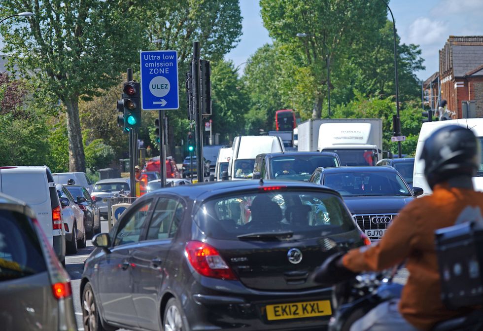 Cars near a Ulez sign