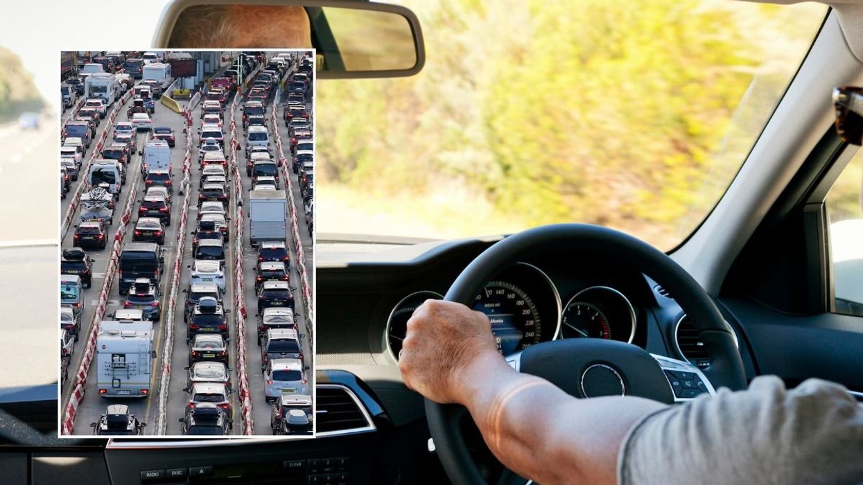 Cars parked and a man driving a car