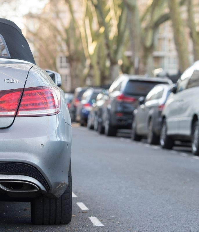 Cars parked and a parking sign