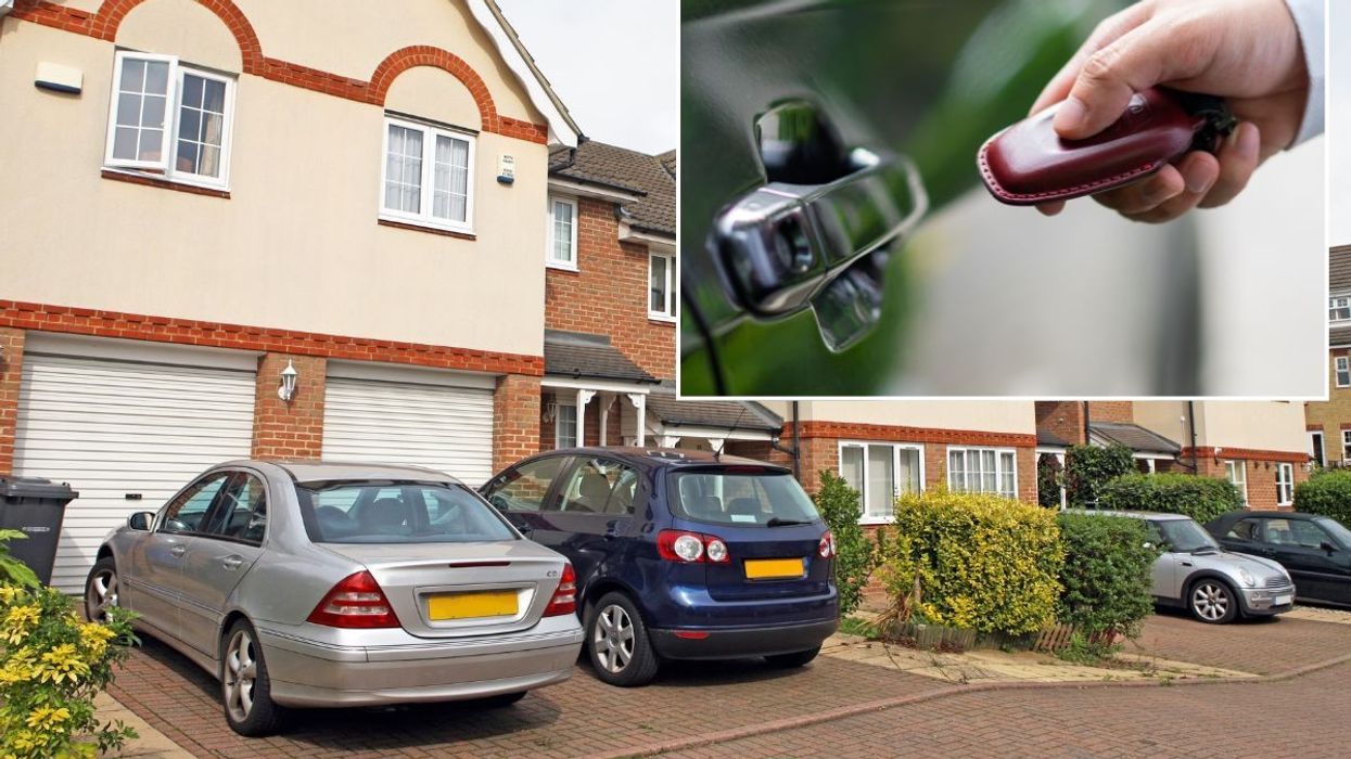 Cars parked on a driveway and a keyless car fob
