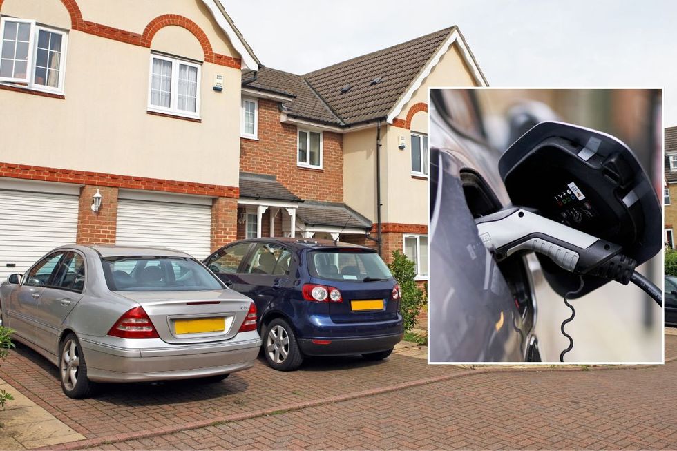 Cars parked on driveway and an electric car charger