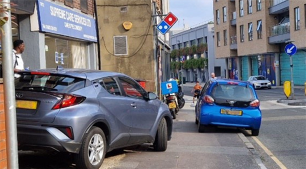 Cars parked on the pavement