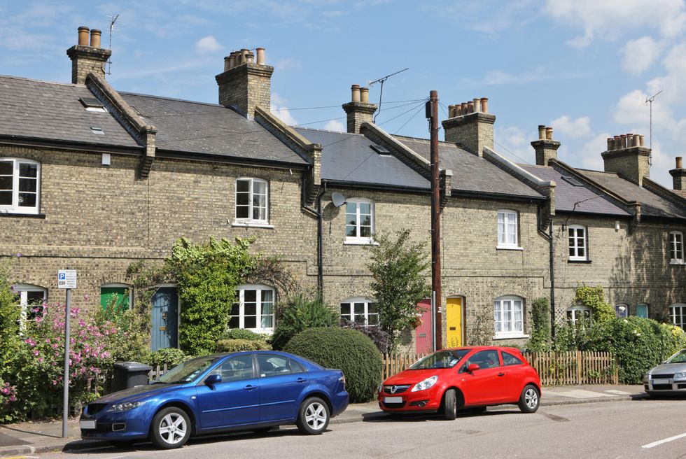 Cars parked outside a set of terrace houses