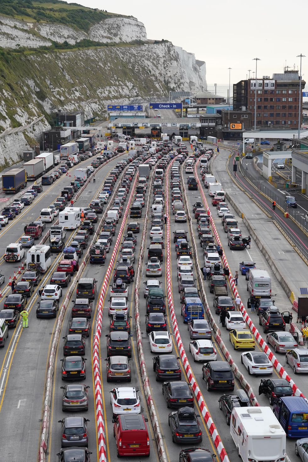 Cars queue at the check-in at the Port of Dover in Kent as many families embark on getaways following the start of summer holidays for many schools in England and Wales. Picture date: Saturday July 23, 2022.