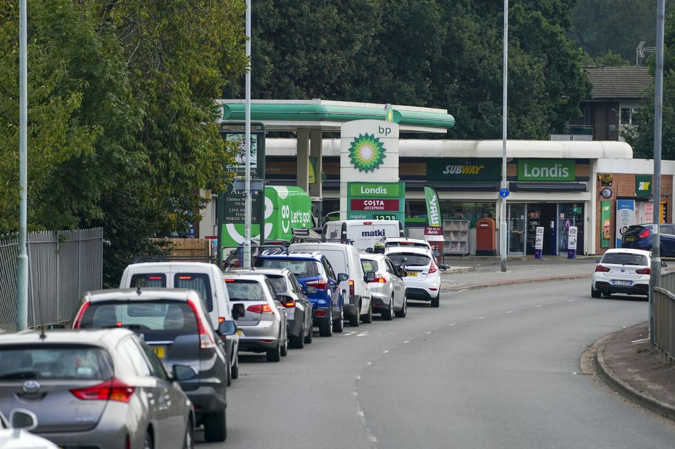Cars queue for fuel at a BP petrol station in Bracknell, Berkshire.