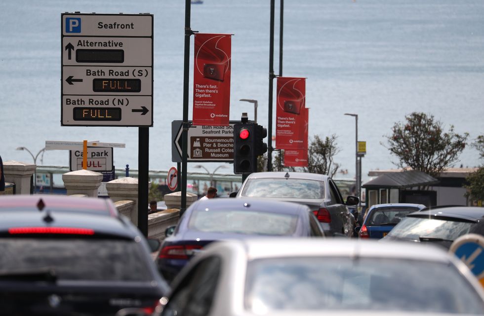 Cars queue up as they head down towards the sea front at Bournemouth beach in Dorset.