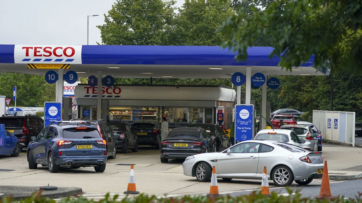 Cars queuing for fuel at a Tesco petrol station