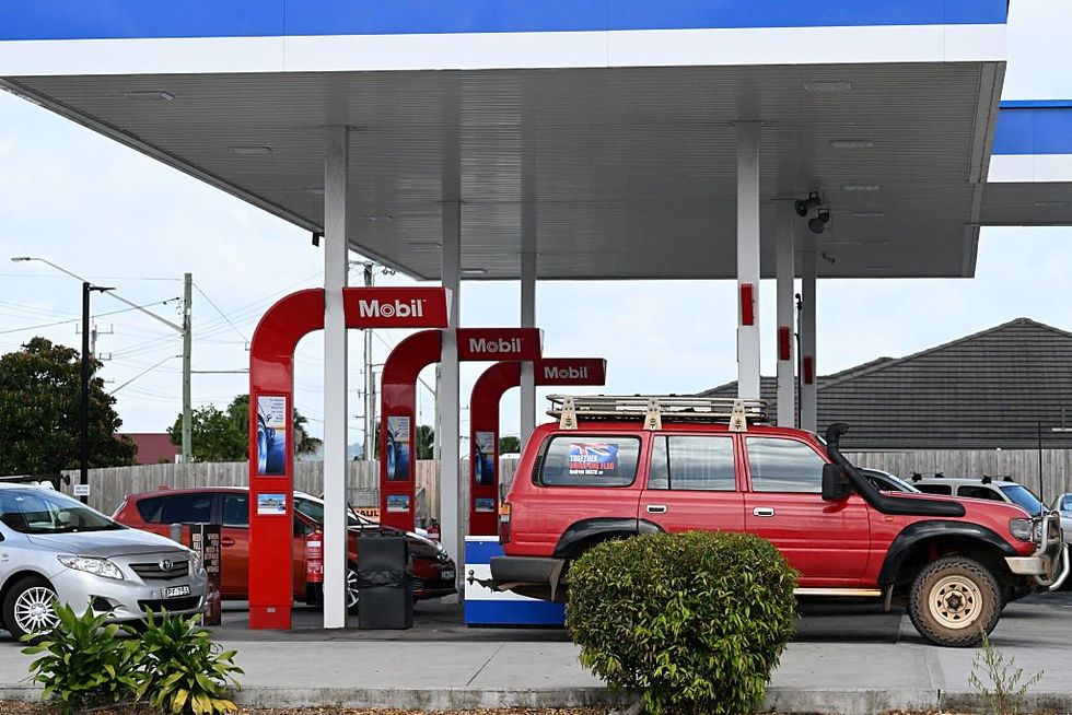 Cars wait in line in Australian petrol station