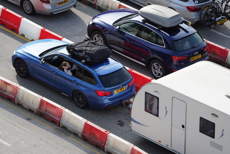 Cars with roof racks going on holiday