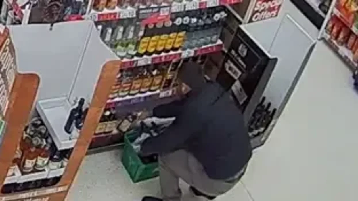 CCTV image of person stealing alcohol
