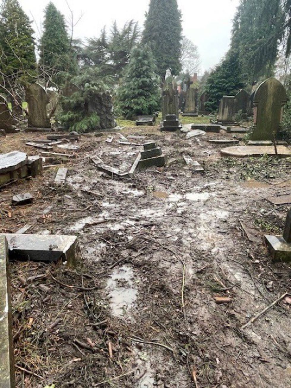 Cemetery left in horror state with graves knocked over and covered in churned earth
