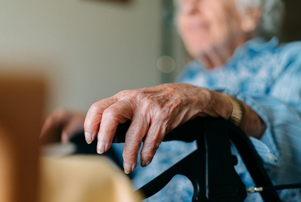 CENTENARIAN SITTING IN WHEELCHAIR