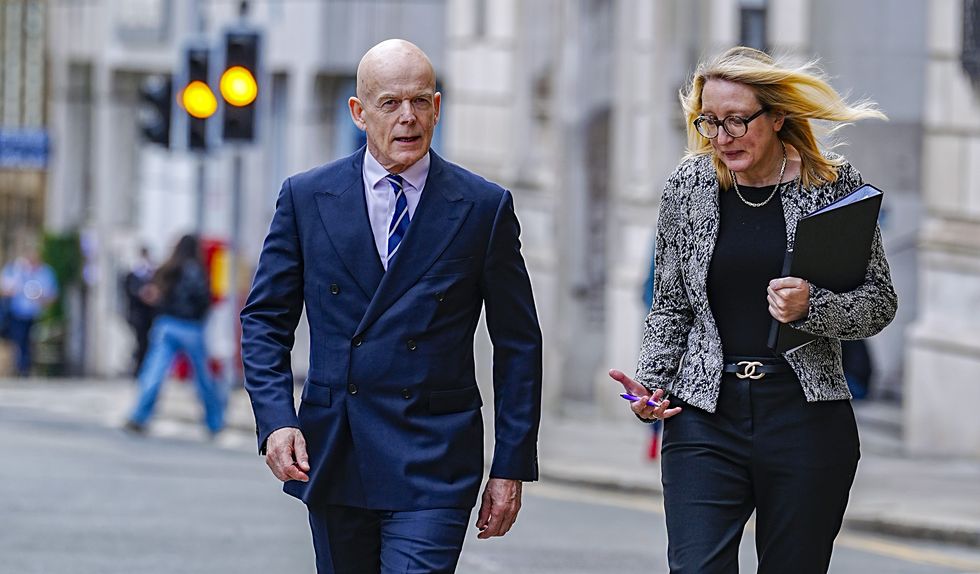 Chair Sir Adrian Fulford arrives with secretary to the inquiry Kate Anderson at Liverpool Town Hall