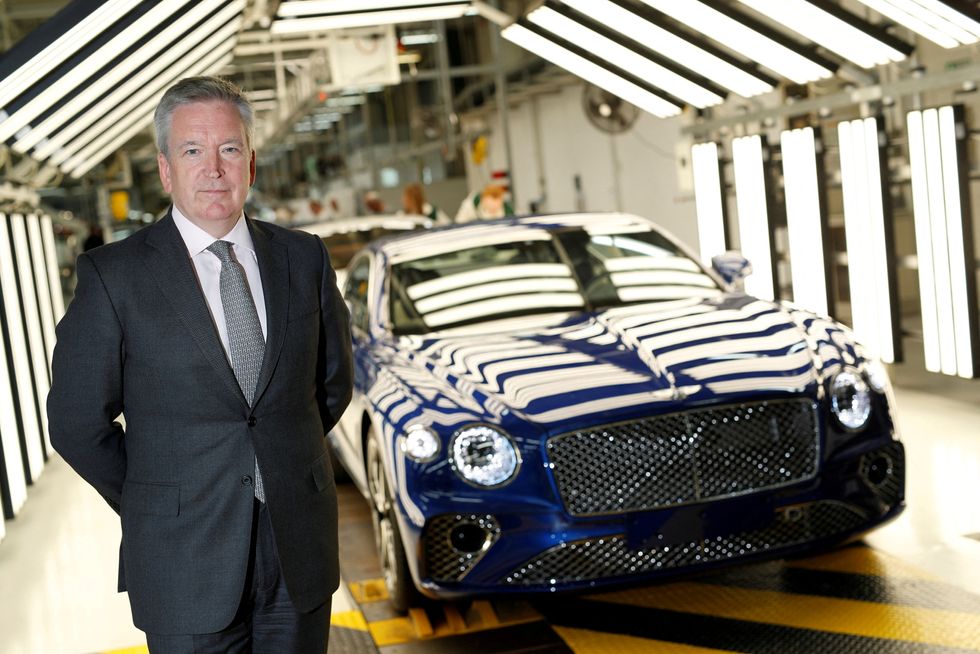Chairman and CEO of Bentley Motors Adrian Hallmark poses at the luxury automaker's manufacturing facility in Crewe