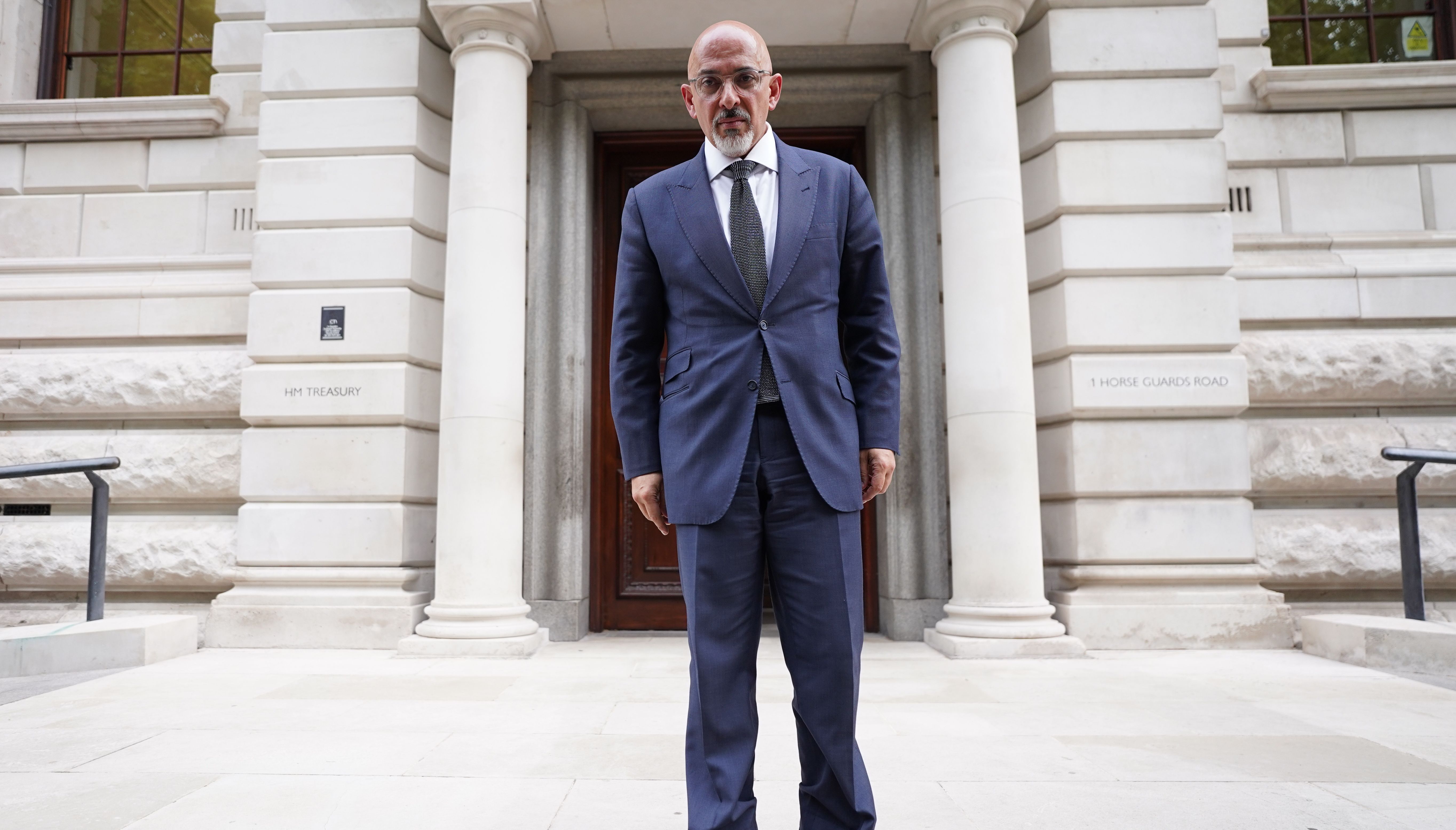 Chancellor Nadhim Zahawi poses for a photograph outside the HM Treasury in Westminster, following his appointment after Rishi Sunak resigned from the post on Tuesday.