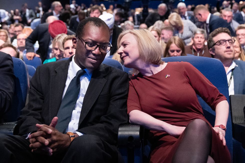 Chancellor of the Exchequer Kwasi Kwarteng, and Prime Minister Liz Truss during a tribute to the late Queen Elizabeth II at the start of the Conservative Party annual conference at the International Convention Centre in Birmingham. Picture date: Sunday October 2, 2022.