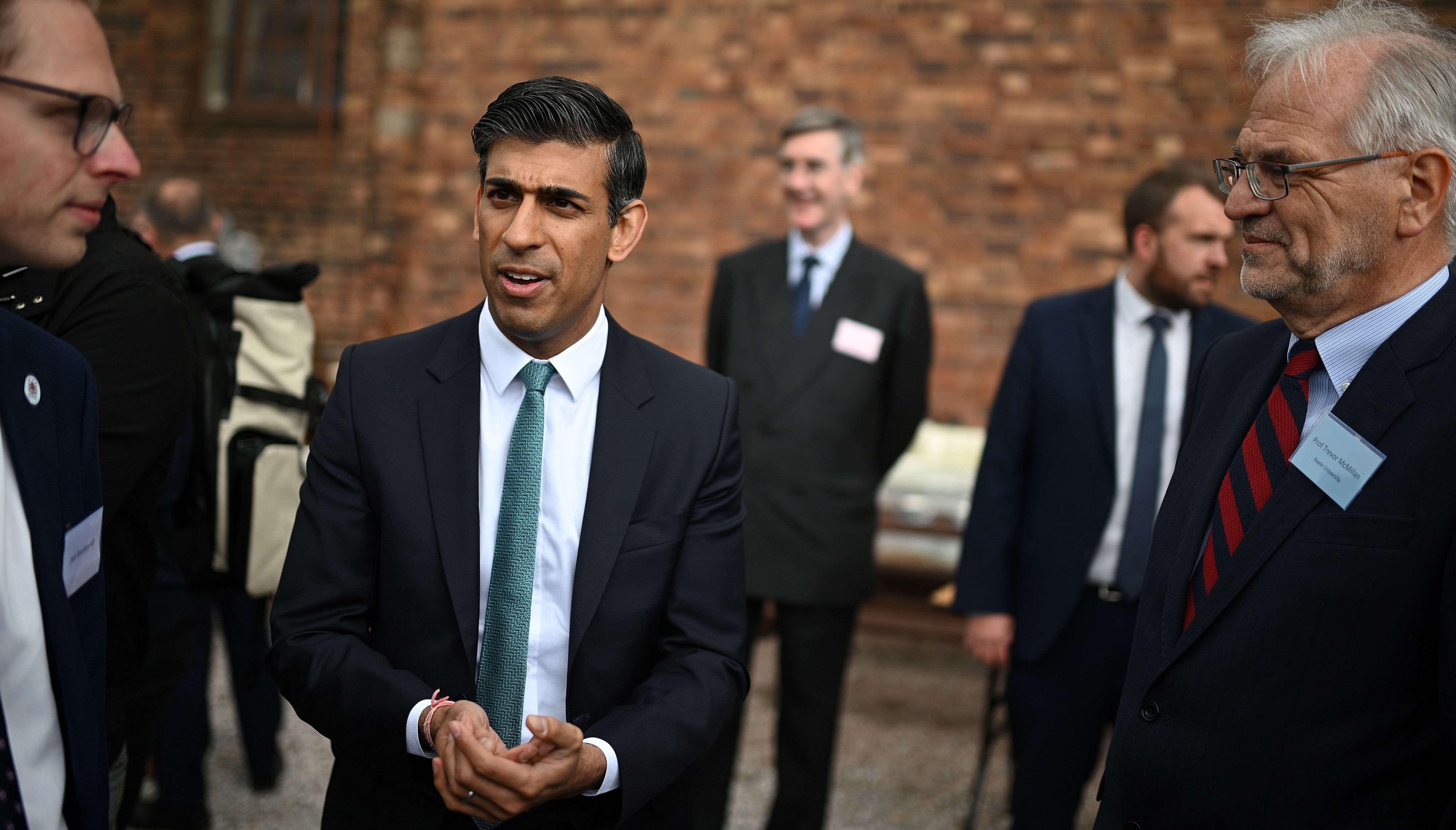 Chancellor of the Exchequer Rishi Sunak (centre) talks to local business people after a regional cabinet meeting at Middleport Pottery in Stoke on Trent.