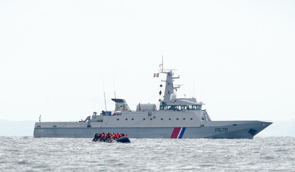 Channel migrants with French patrol boat