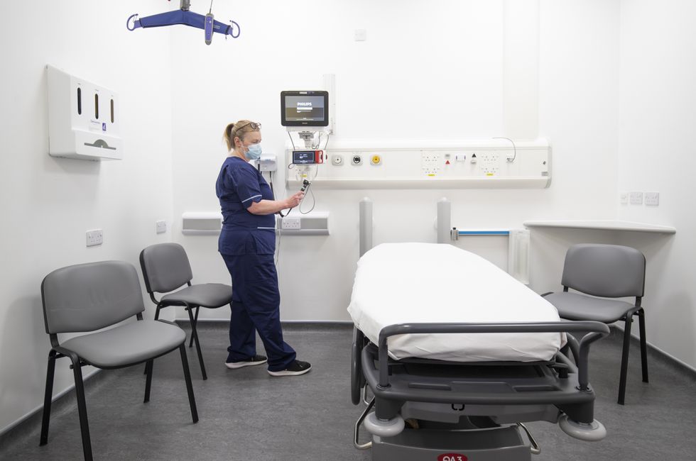 Charge nurse Katy Currie sets up equipment in one of the treatment rooms in the Emergency Department at the new Royal Hospital for Children and Young People Edinburgh.