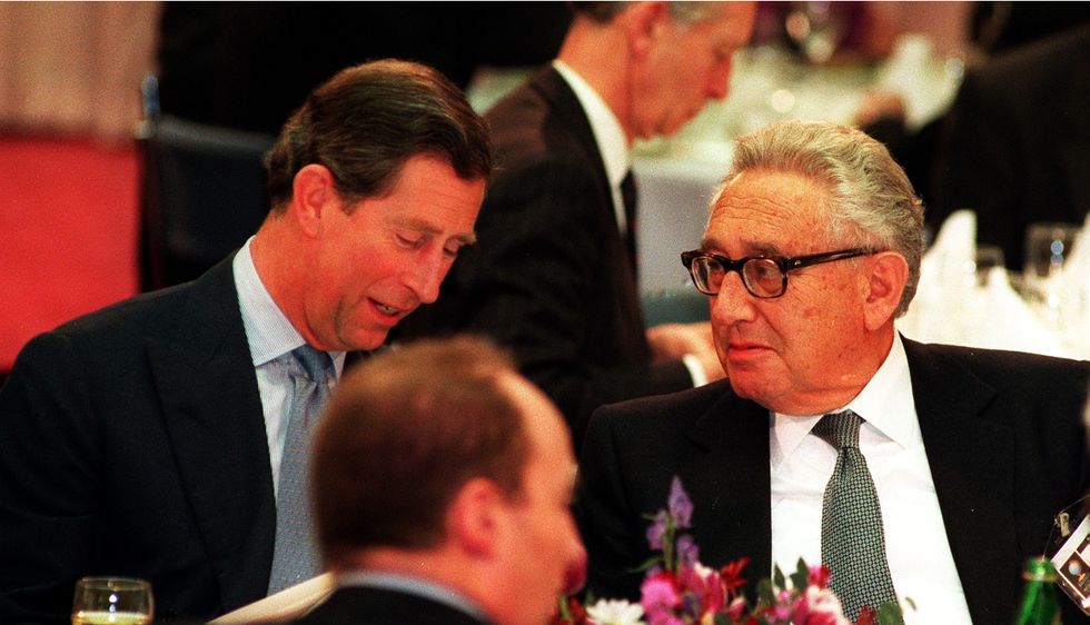 Charles talks with Kissinger during the Britain In The World conference at the Royal Institute of International Affairs in London, 1995