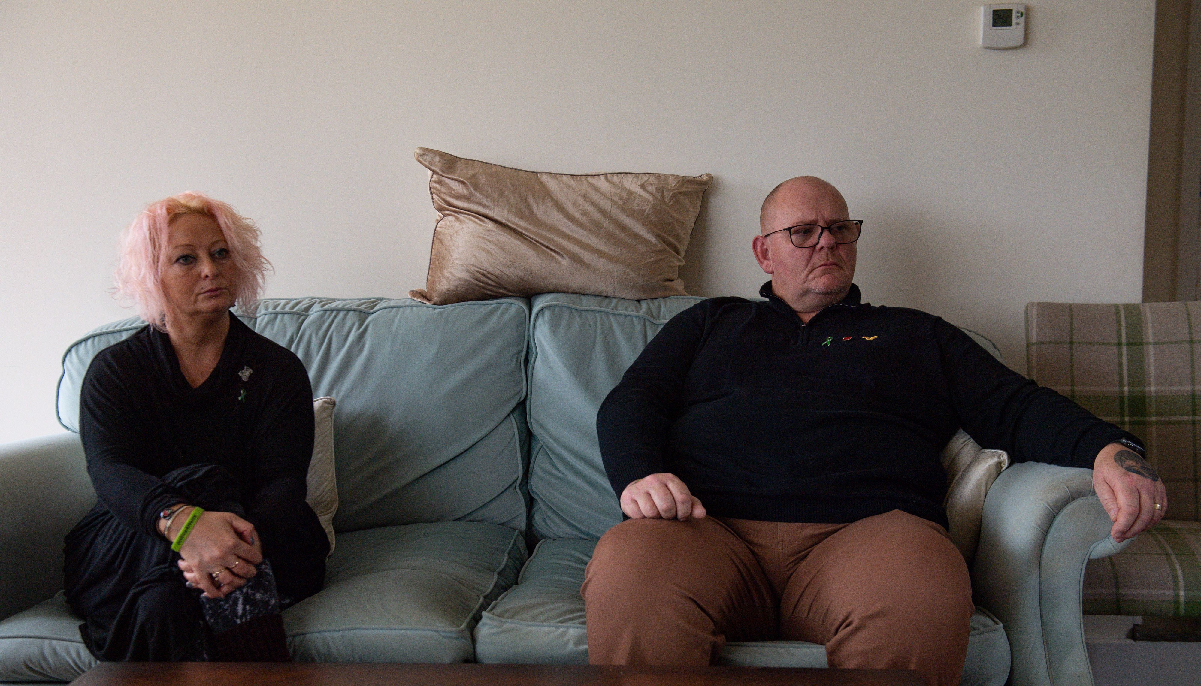 Charlotte Charles and Tim Dunn, the mother and father of Harry Dunn, at home in north Oxfordshire observe proceedings at the High Court via videolink.