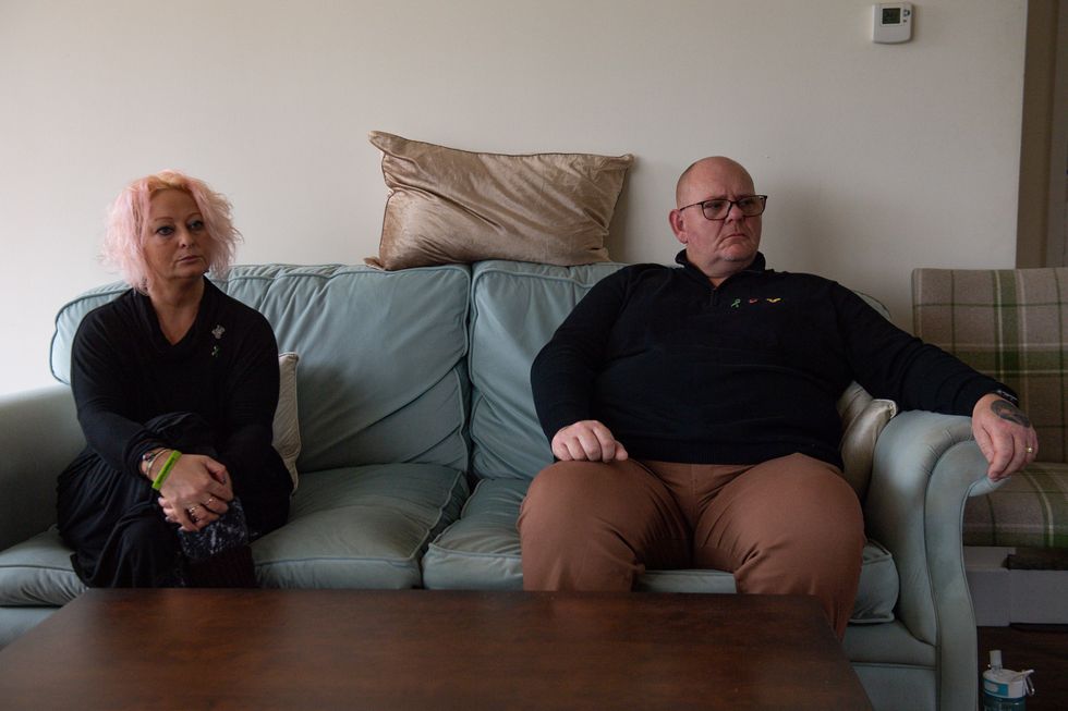 Charlotte Charles and Tim Dunn, the mother and father of Harry Dunn, at home in north Oxfordshire observe proceedings at the High Court via videolink.