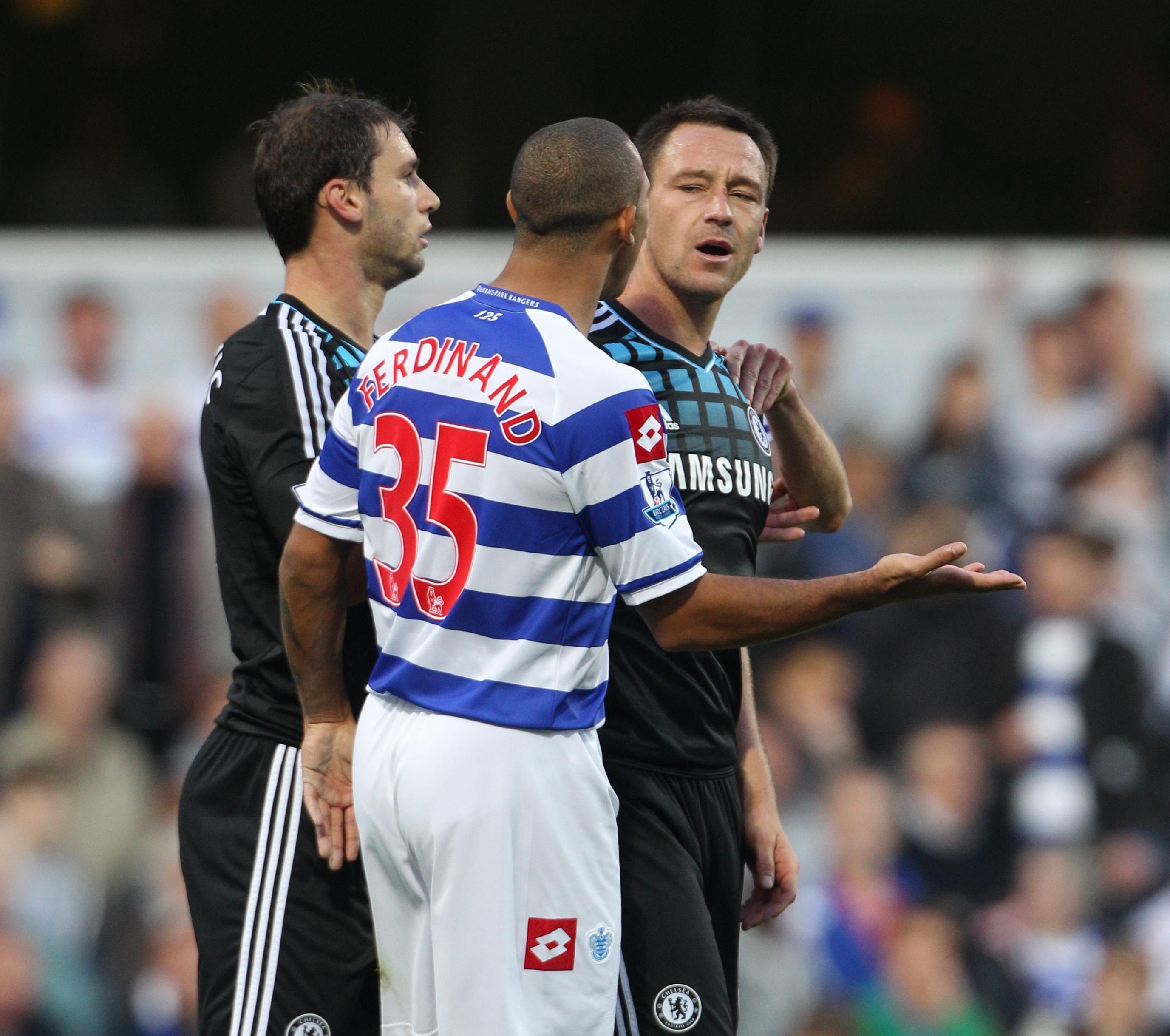 Chelsea captain John Terry (right) speaking with QPR's Anton Ferdinand during the Barclays Premier League match at Loftus Road, London.