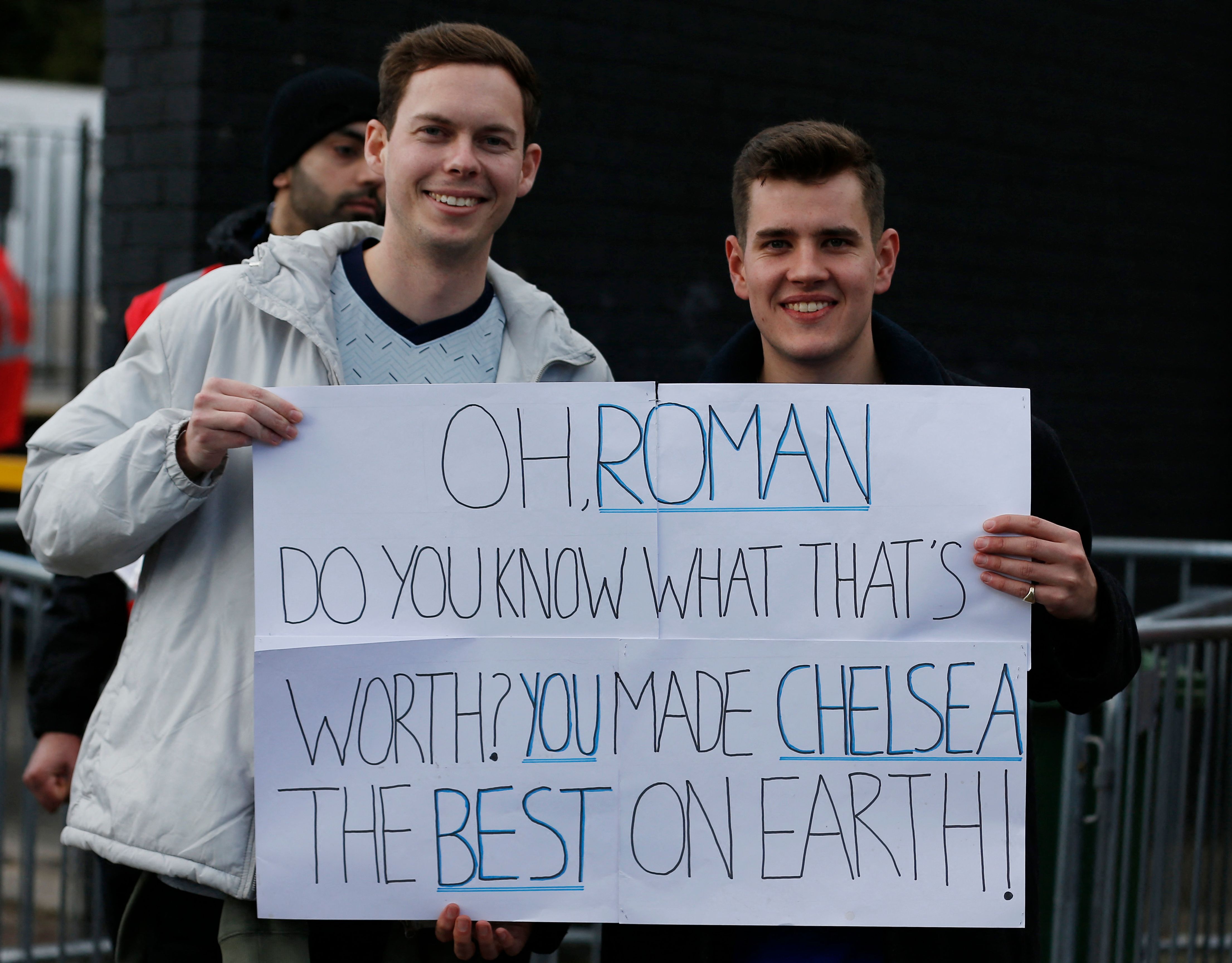 Chelsea fans are pictured with a message for Roman Abramovich outside the stadium before their match against Burnley