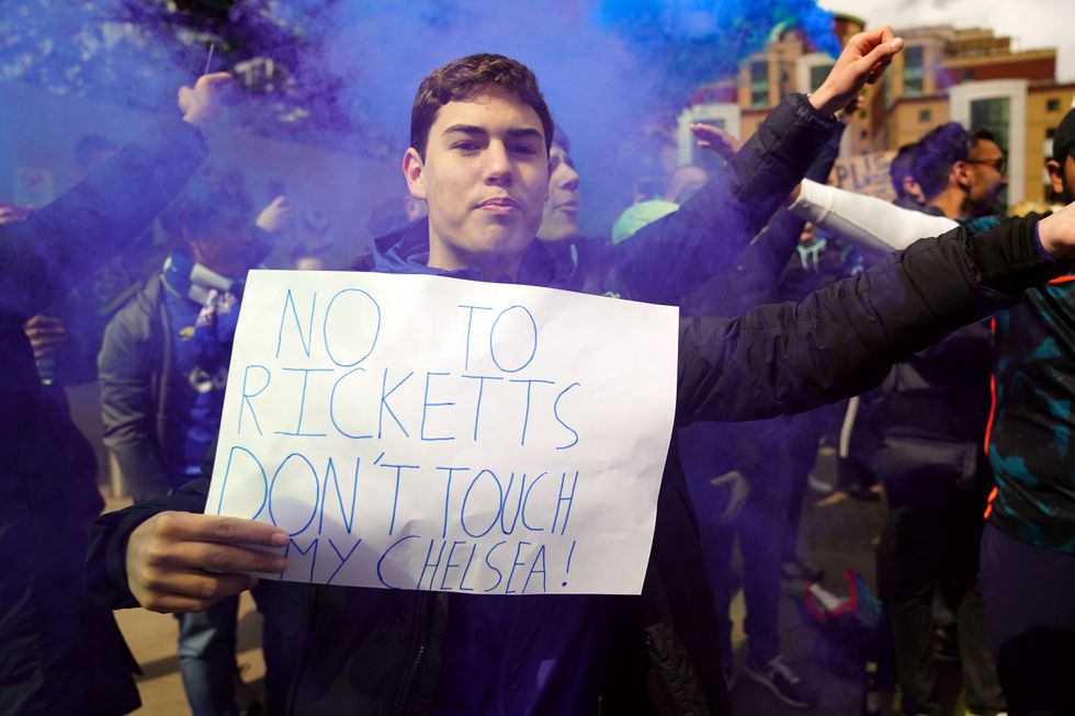 Chelsea fans protest outside the ground against the potential sale of the club to the Ricketts family ahead of the Premier League match at Stamford Bridge, London. Picture date: Saturday April 2, 2022.