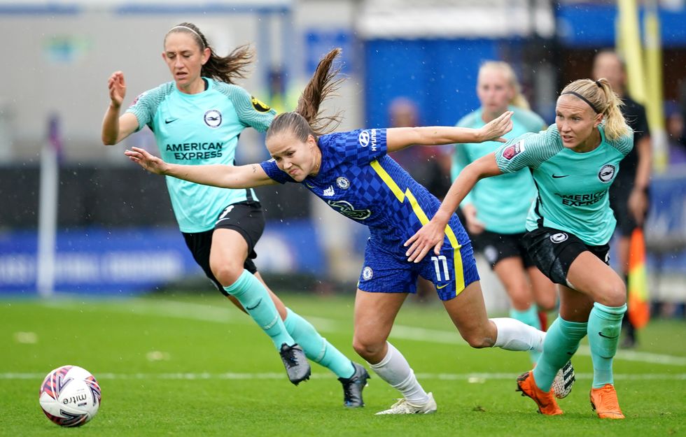 Chelsea's Guro Reiten (centre) battles for the ball with Brighton and Hove Albion's Aileen Whelan (left) and Emma Koivisto during the FA Women's Super League match at Kingsmeadow, London. Picture date: Saturday October 2, 2021.