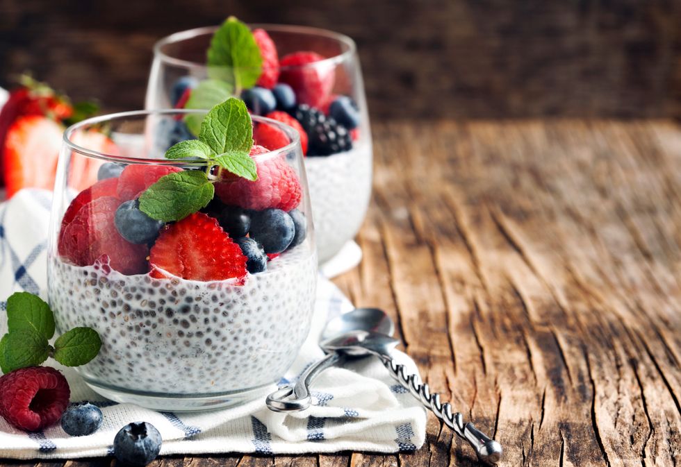 Chia seed pudding in a glass with strawberries, raspberries and blueberries