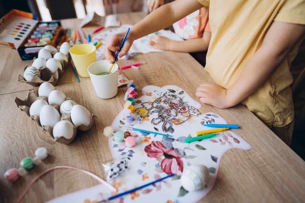 Child decorating eggs for Easter.