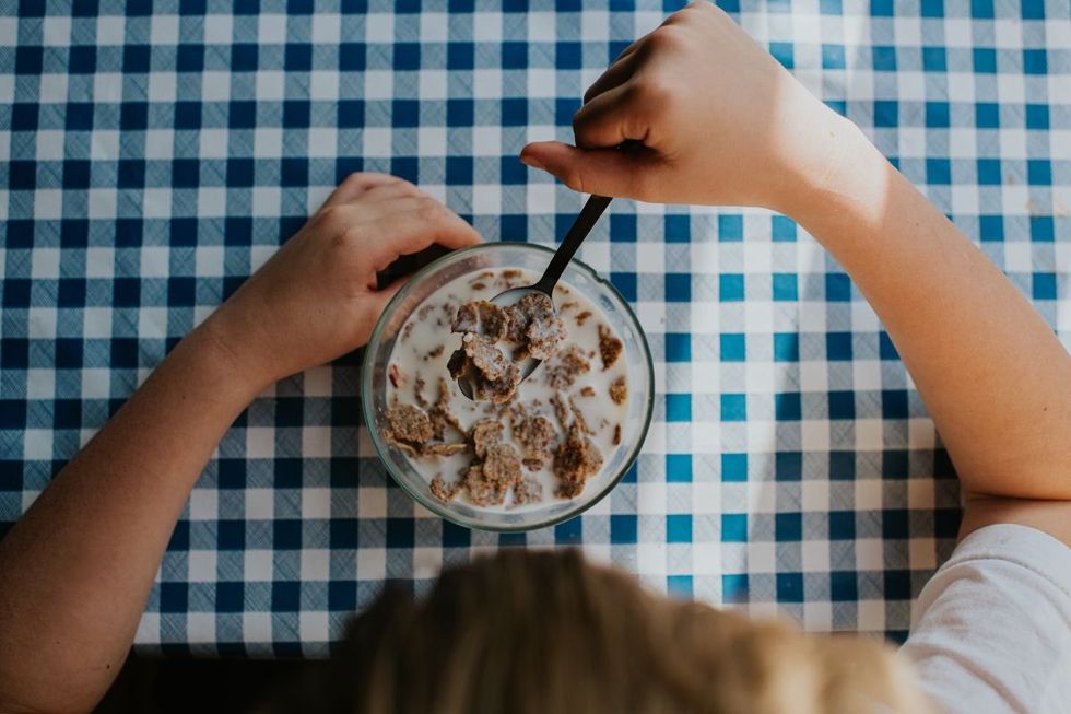 CHILD EATING BOWL OF CEREAL