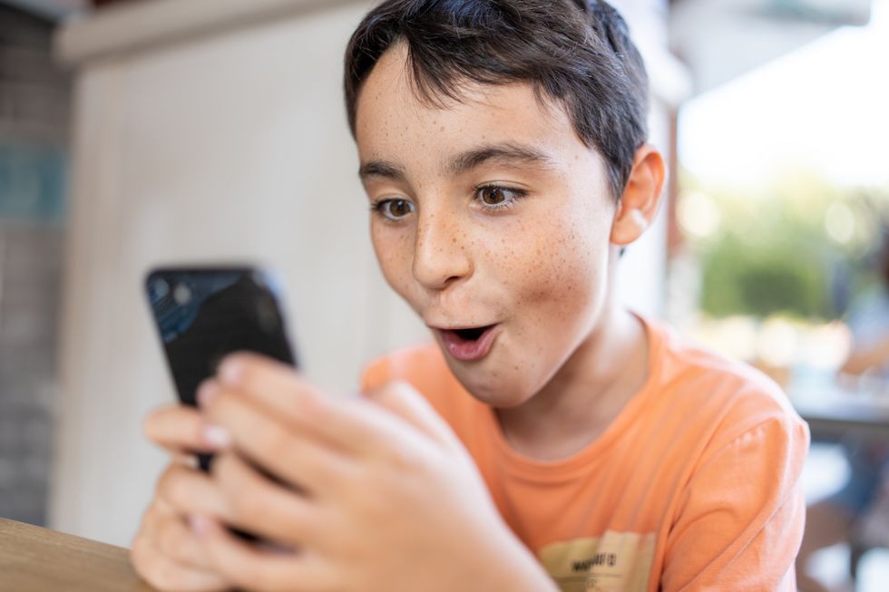 Child engaged with phone