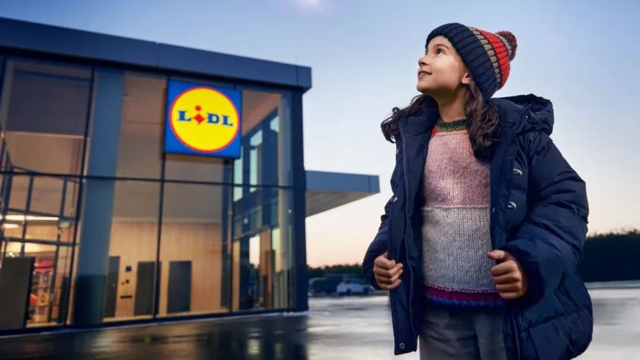 Child from Lidl Christmas advert outside supermarket