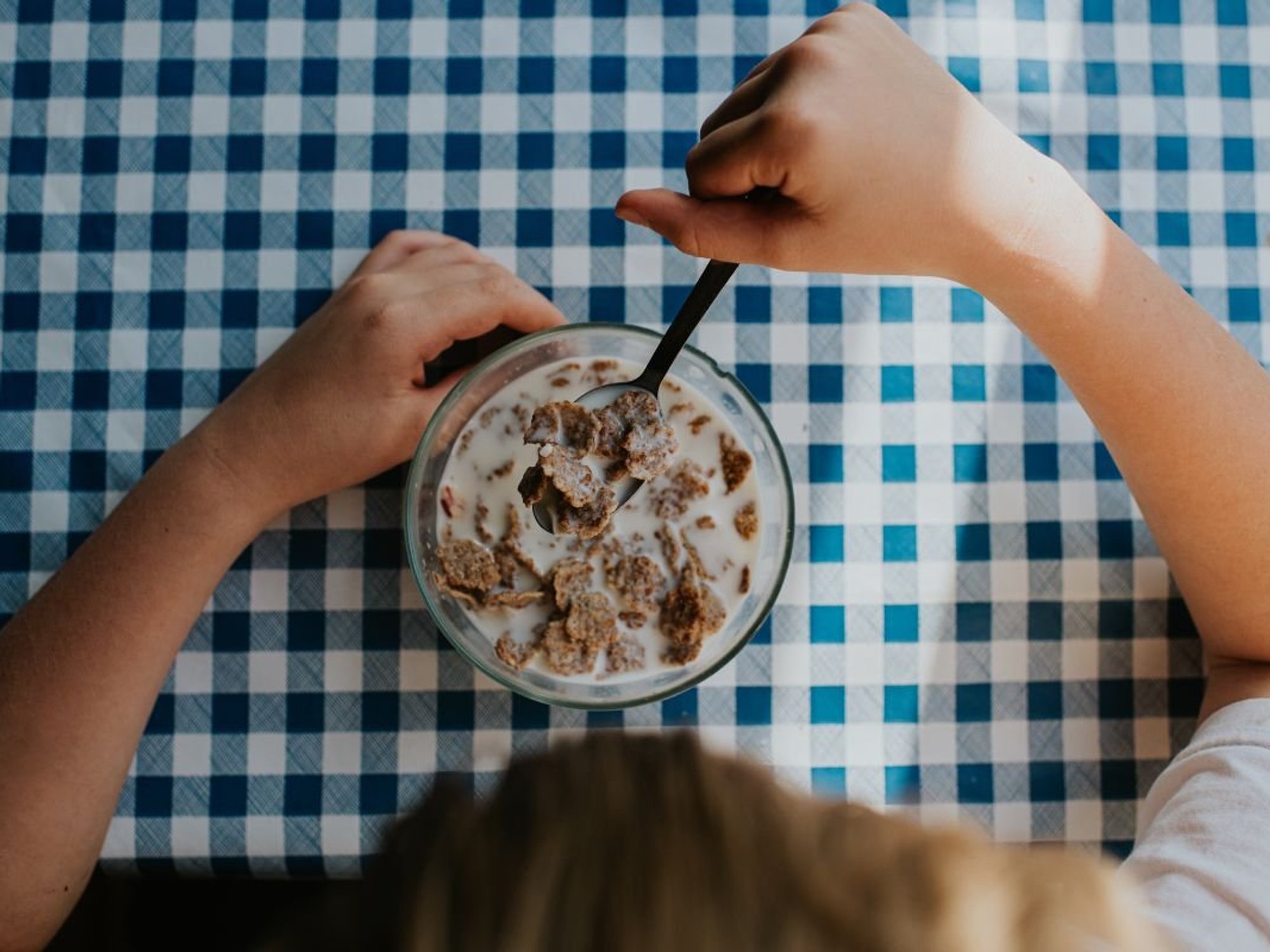CHILD HAVING BOWL OF CEREAL
