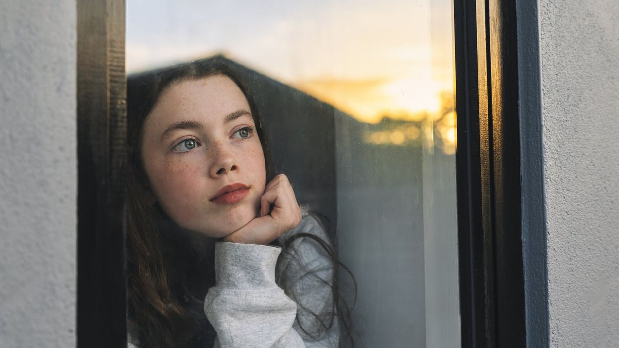 Child looking out of window