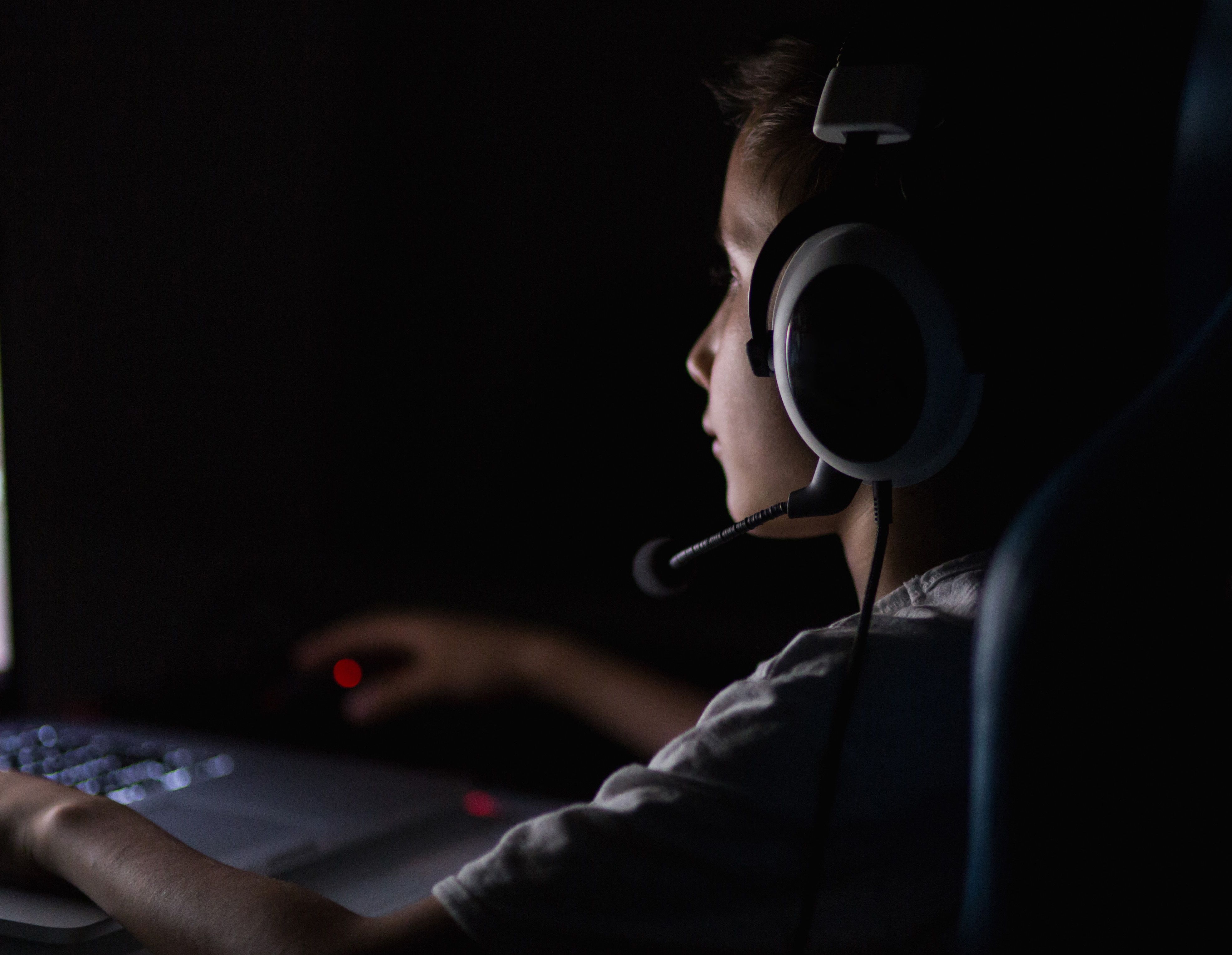 Child on a computer in a dark room