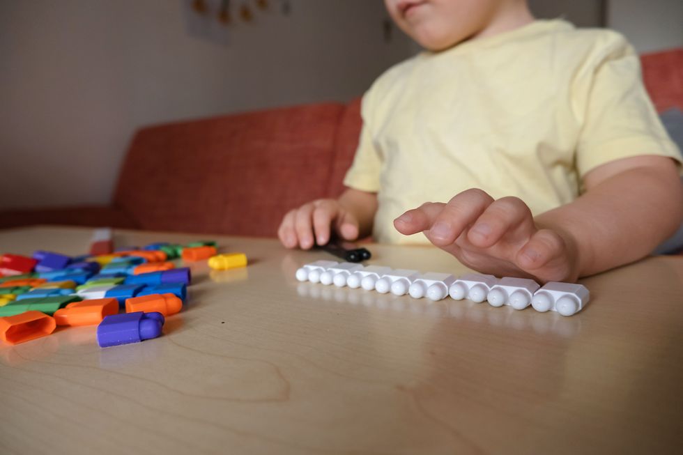Child playing with bricks