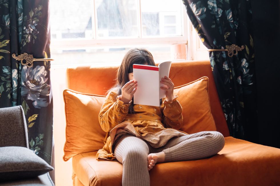 Child reads a book