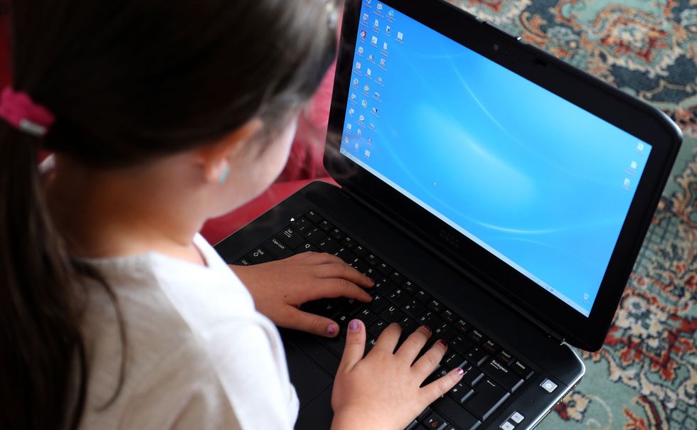 Child using a laptop computer