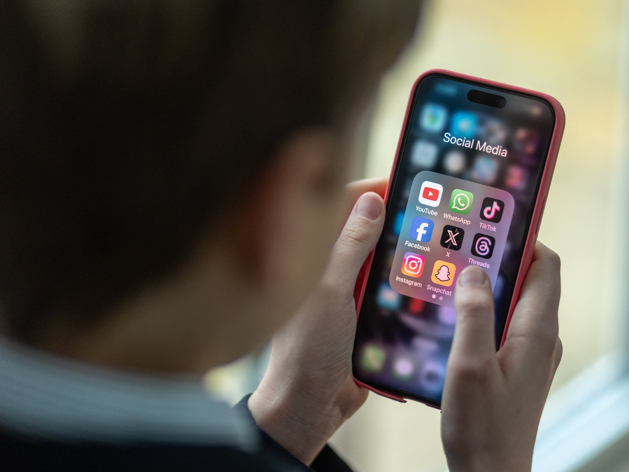 Child using social media on smartphone